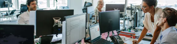 Colleagues working in a busy office